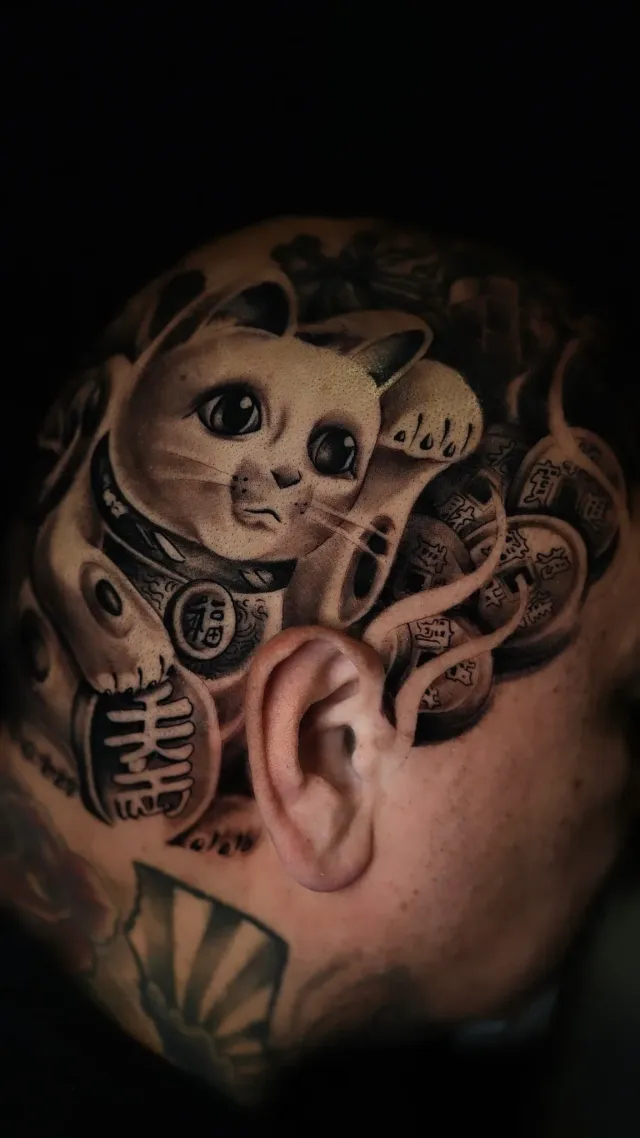 Maneki-neko cat tattoo