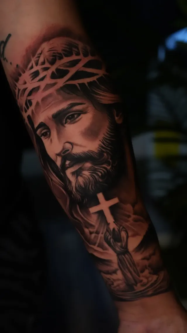 Jesus with crown of thorns tattoo