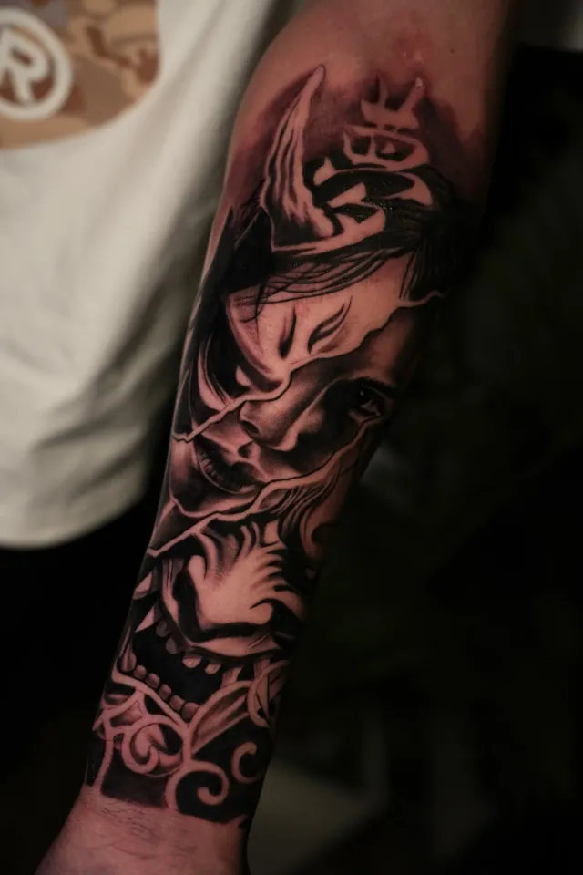 Oni demon forearm tattoo