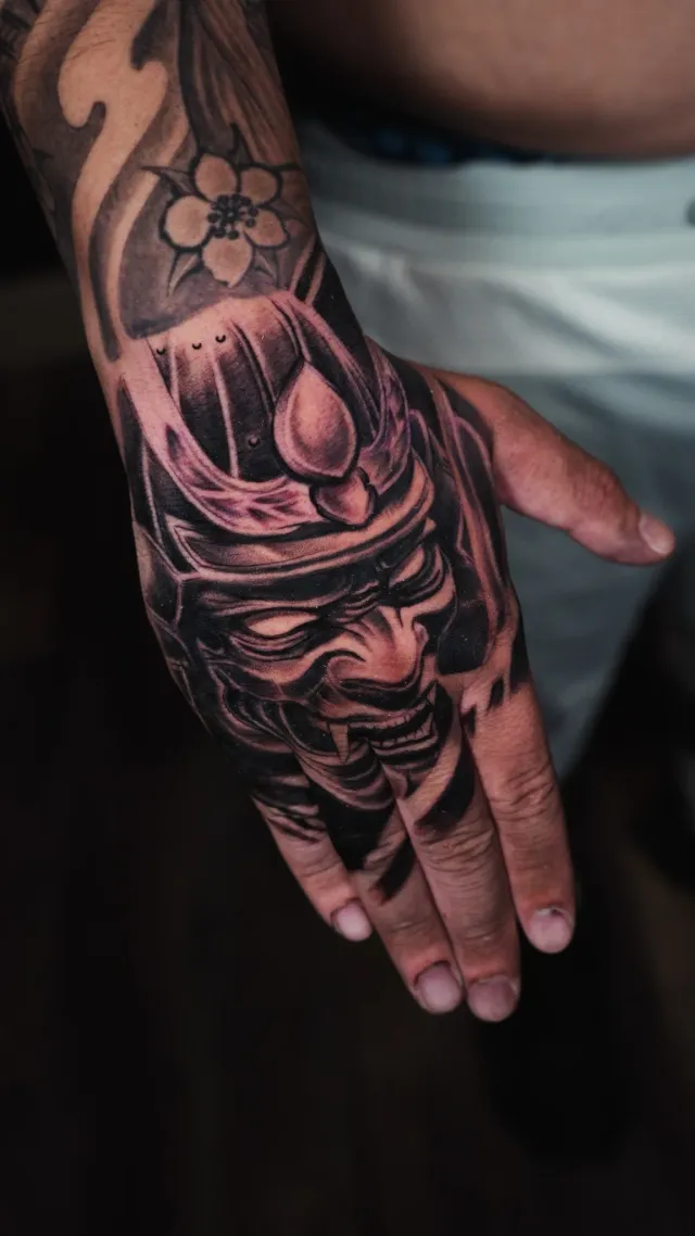 Floral ornamental hand tattoo