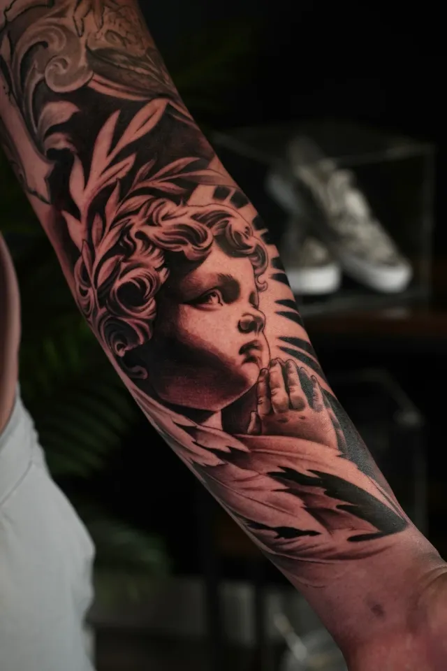 Woman profile and floral tattoo