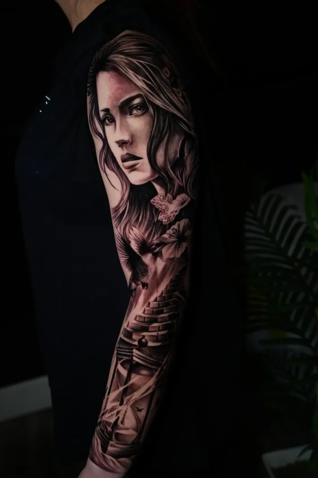 Woman portrait sleeve tattoo