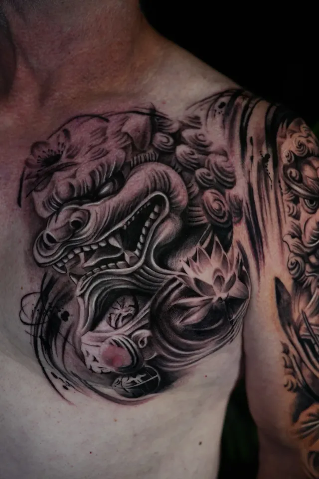 Foo dog chest tattoo