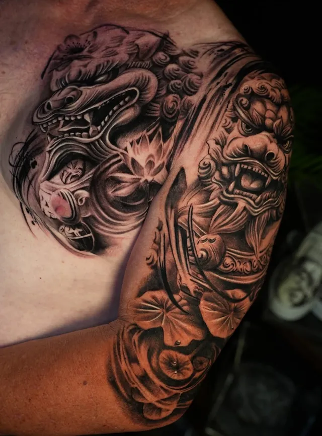 Asian guardian chest and sleeve realism tattoo