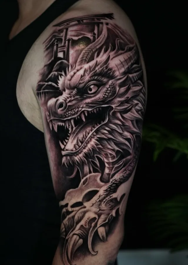 Dragon and skull realism tattoo