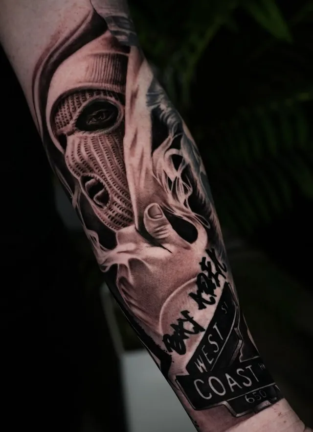 West Coast themed black and grey realism forearm tattoo