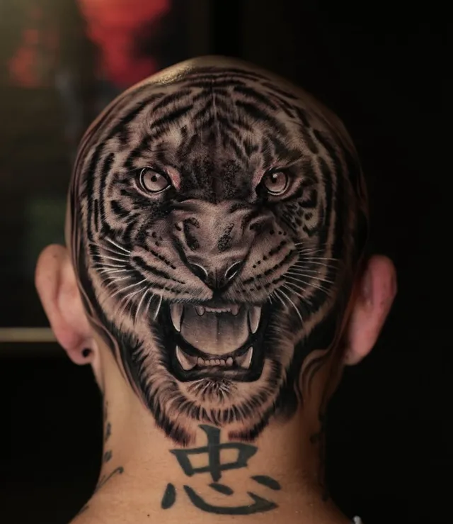 Tiger head tattoo on scalp