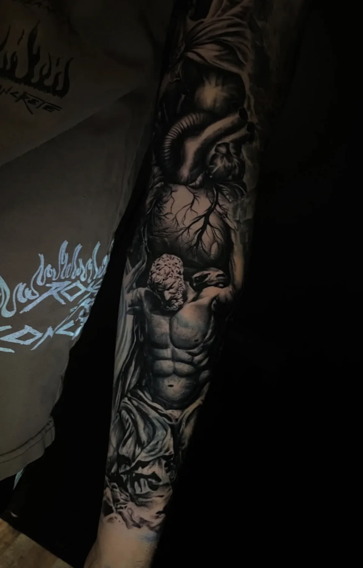 Black-and-grey anatomical heart and classical sleeve.