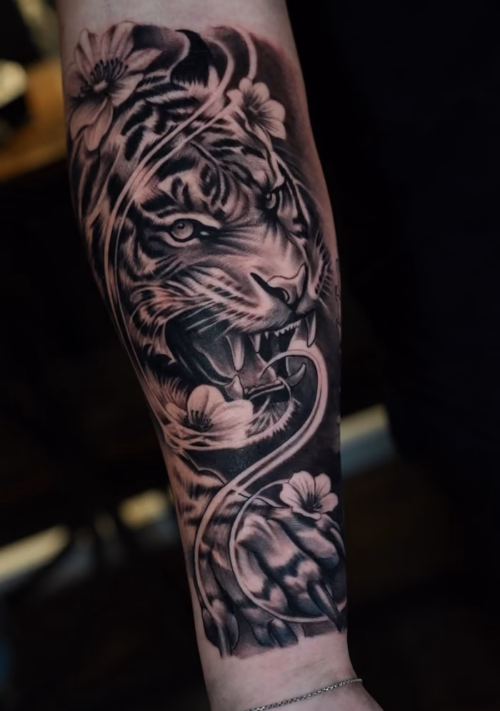 Tiger and flower forearm tattoo by BillyDaKid