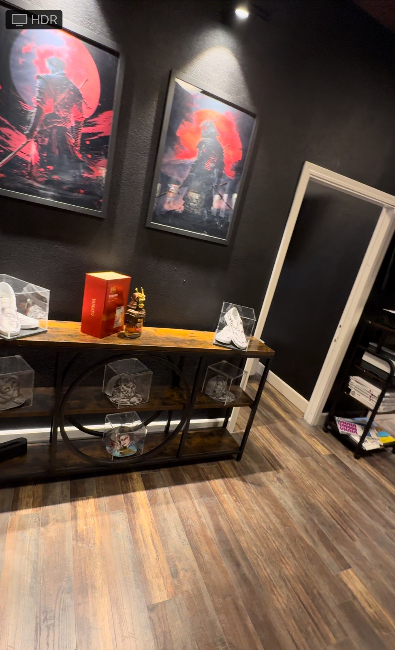 Framed artwork and custom displays inside Tattoo Nerds